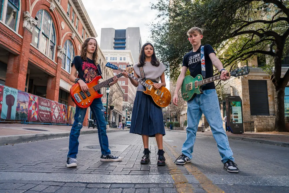 Band posing together for a photo shoot downtown